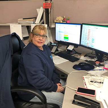 Sheri Pike working at her desk