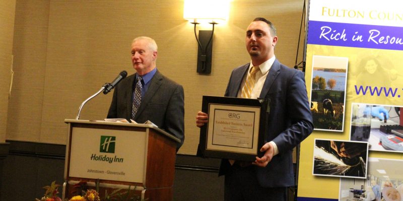 LA Transport, Inc./Universal Warehousing, Inc. General Manager Andrew Olbrych, left, and Vice President Dave Groff are presented with the Large Established Business Award